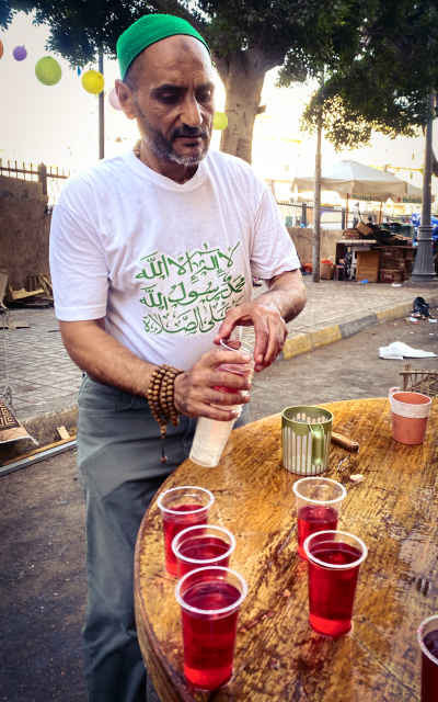 Sharbat Vendor Pouring Festive Drink, Al-Manshiya Alexandria