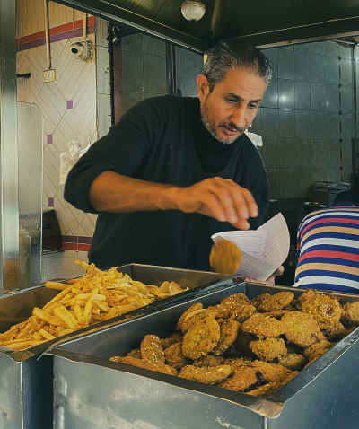 Falafel Vendor Serving Street Food, Kom El Dekka Alexandria