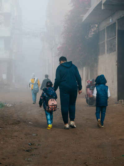 Father Walking Children to School, Foggy Morning Egypt