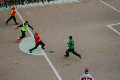 Four Players Challenge for the Ball at Al Falaki Tournament