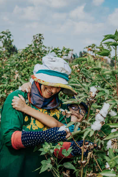Female Cotton Picker with Child, Nimrat Al-Basal Village