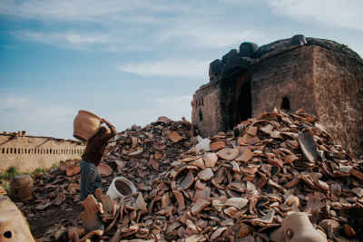 Potter Carrying Clay Vessel at Kiln, Kom Oshim Fayoum