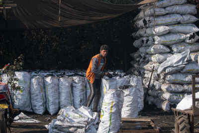 Charcoal Worker Stacking Sacks, Bilbeis Sharqia Egypt