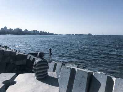 Man Sitting on Breakwater, Alexandria Mediterranean Coast