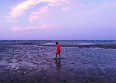 Child Walking on Beach at Dusk, Suez Egypt