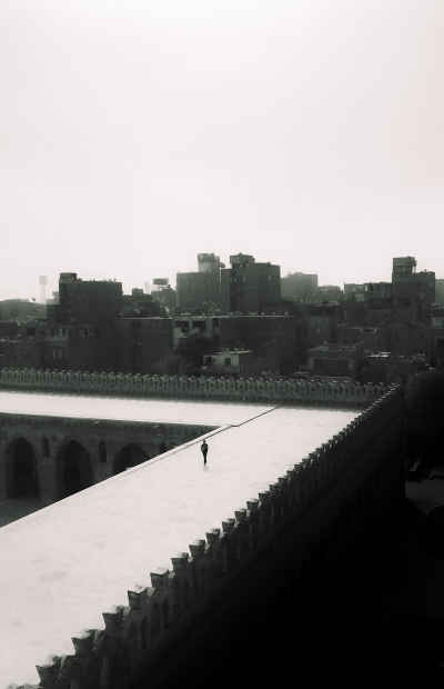 Lone Figure on Ibn Tulun Mosque Roof, Cairo