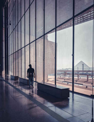 Visitor Walking Inside Grand Egyptian Museum, Giza