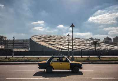 Yellow Taxi Passing Bibliotheca Alexandrina, Alexandria