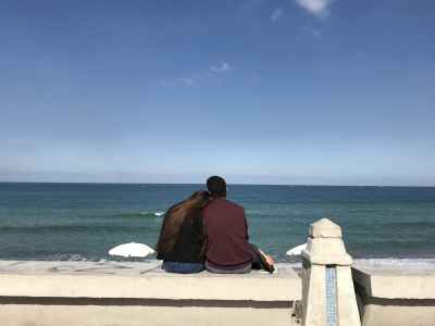 Couple Sitting on Alexandria Corniche, Mediterranean Sea