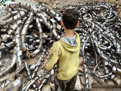 Child Among Scrap Metal in Egypt