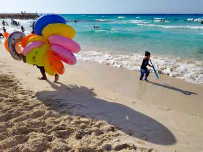 Float Vendor and Child at El Abyad Beach, Marsa Matruh