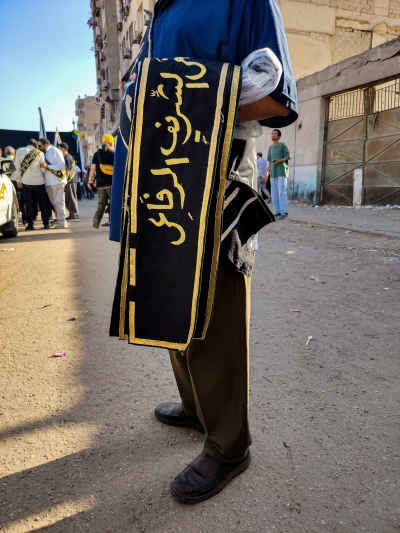Scarf Seller at Islamic New Year 1448 Celebration Egypt