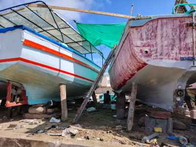 Man Resting Between Wooden Boats, Ras al-Tin Alexandria