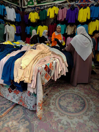 Mother Buying School Uniforms at Cairo Market