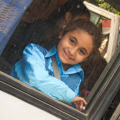 Egyptian Schoolgirl in Blue Uniform, School Bus Window