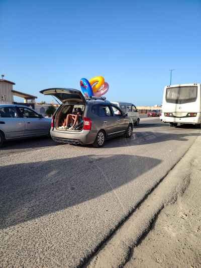 Children Riding in Car Boot, Marsa Matruh Summer