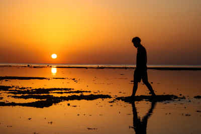 Man Walking at Sunrise on Al-Quseir Beach, Red Sea