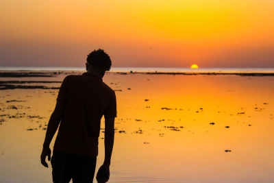 Man Walking at Sunrise on Al-Quseir Beach, Red Sea