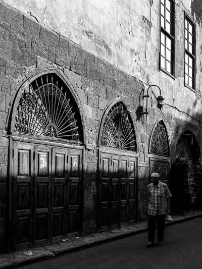 Egyptian Man Walking Al-Ashraf Street Cairo Black White
