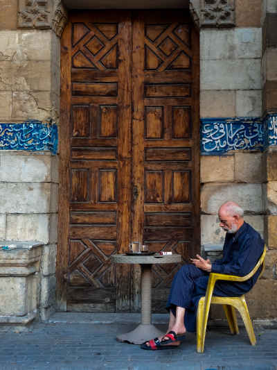 Man at Café Chair, Sayyida Sakina Mosque Gate, Cairo