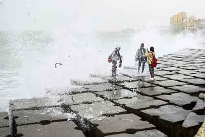 People on Stone Pier During Wave Splash, Alexandria