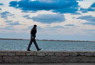 Man Walking on Seafront Promenade, Alexandria Egypt