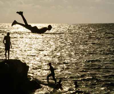 Youth Cliff Jumping into Sea, Alexandria