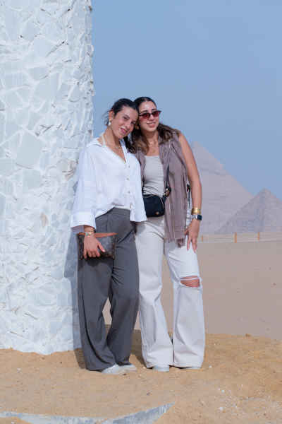 Two Women Posing at Giza Pyramids Plateau