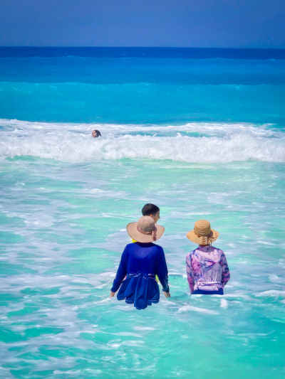 Women Wading in Turquoise Sea, Island Beach Al-Alamein