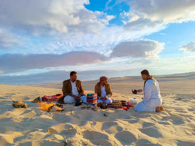 Men Sharing Tea on Siwa Desert Sand Dunes