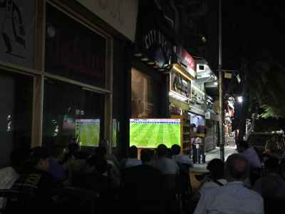 Crowd Watching Football Match at Cairo Street Café Night