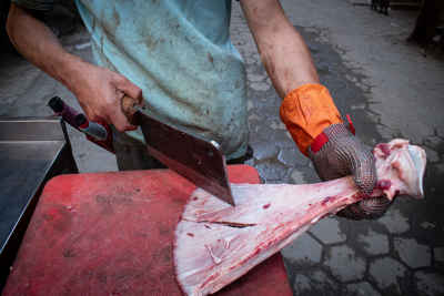 Egyptian Butcher Breaking Shoulder Blade Bone with a Cleaver in Old Maadi