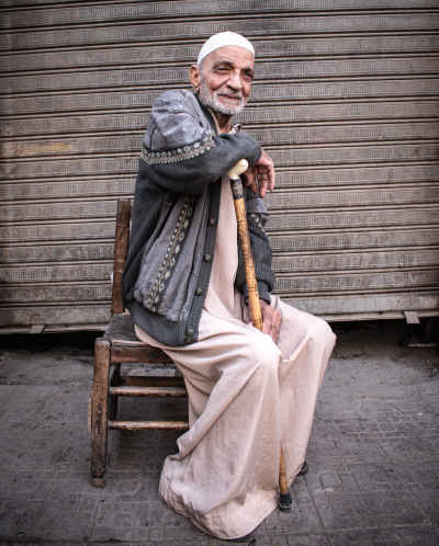 Elderly Man Seated on Street, Darb Al-Ahmar Cairo