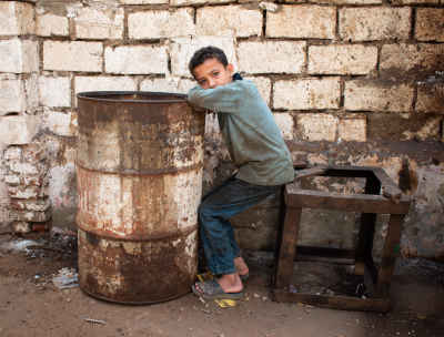 Young Boy Near Rusty Barrel, Rashid Egypt