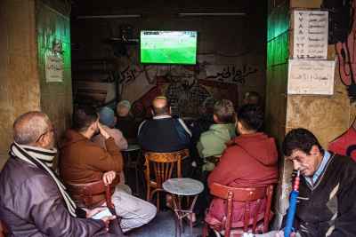 Football Match Viewing at a Traditional Café in Historic Mamluk Desert