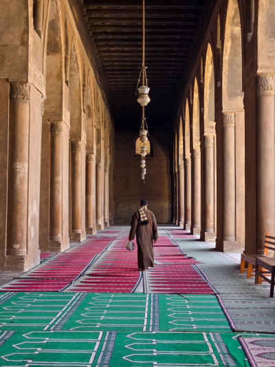 Man Walking Inside Ibn Tulun Mosque Cairo