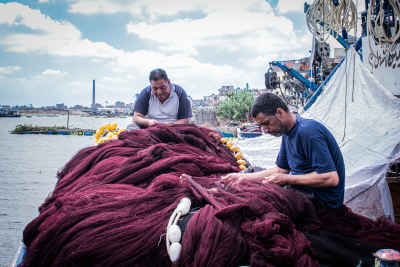 Fishermen Repairing Nets on Boat, Rashid Egypt