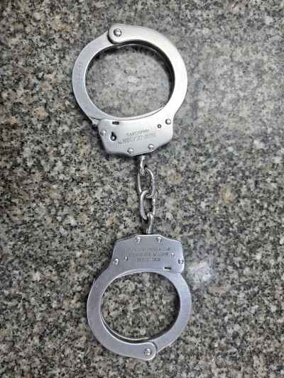 Metal Police Handcuffs on Granite Surface, Cairo
