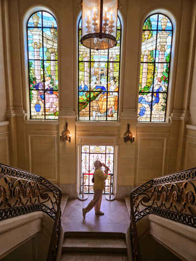Visitor Admiring Stained Glass at Aisha Fahmy Palace
