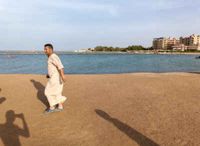 Man Walking Along Hurghada Waterfront Promenade