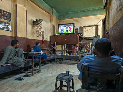 Men Watching Football Match in Traditional Café, Qena