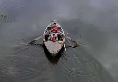 Two Children Rowing Wooden Boat on Nile, Qena