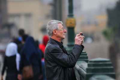 A man stands on Kasr el Nil Bridge in Cairo