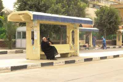 Abbassia Cairo Bus Stop Elderly Man Sitting and Waiting