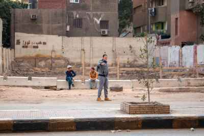 Three Boys on Cairo Working-Class Neighborhood Street