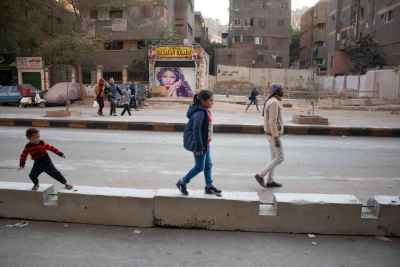 Children and Man Walking on Sudan Street, Cairo