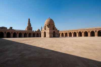 Architectural view of the central dome and spiral minaret of the historic Ahmad Ibn Tulun Mosque in Old Cairo, Egypt - 2