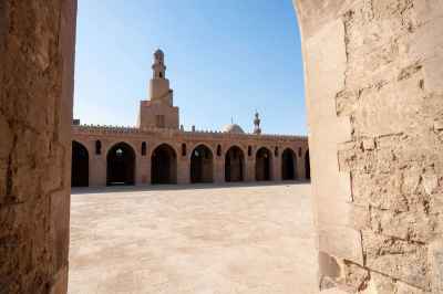 Architectural view of the central dome and spiral minaret of the historic Ahmad Ibn Tulun Mosque in Old Cairo, Egypt - 5