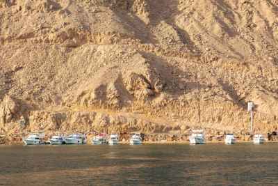 Boats Docked by the Rocky Waterfront in Ain Sokhna
