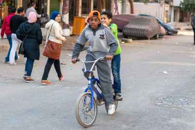 Two Boys Sharing Bicycle on Sudan Street Cairo